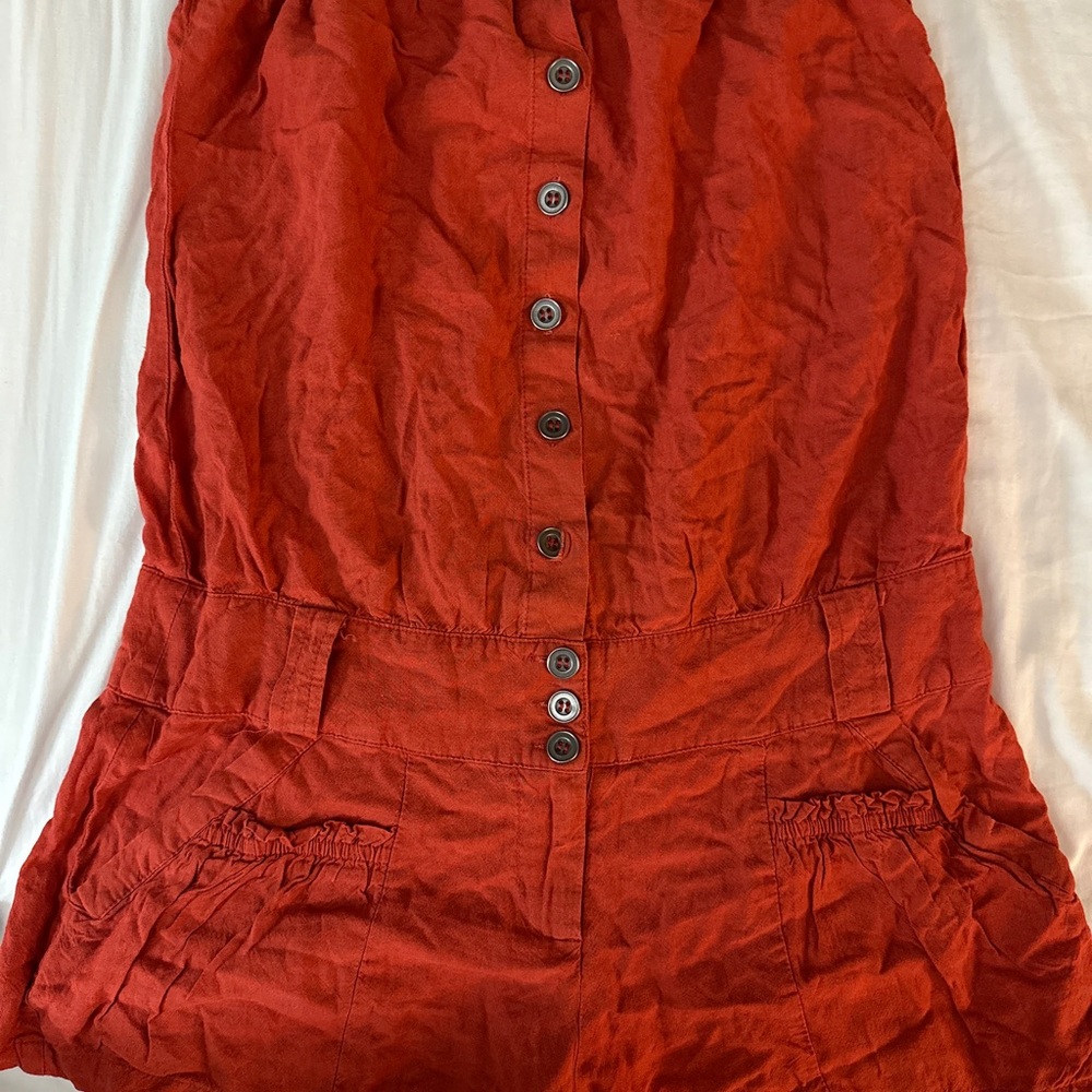 burnt orange romper Size small brand name is Ya material is Made In China